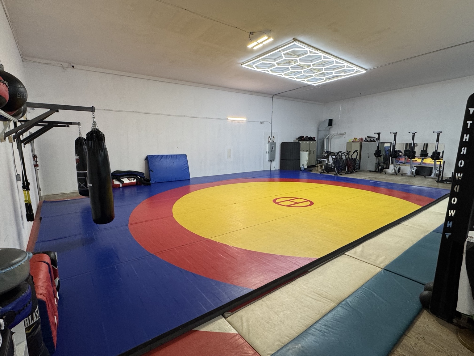 Wrestling mat and training equipment inside BFCA